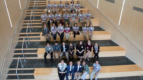 Group shot of participants on BEC atrium steps
