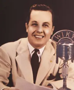 Kenneth Peva McCutchan  with WIKY microphone
