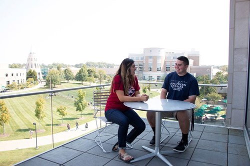 Two students on balcony of BEC