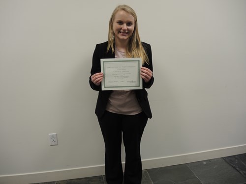 Caitlin holding certificate