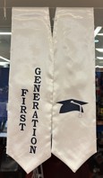 white stole with the words First Generation in black on one side and black graduation cap on the other side