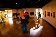 Student admiring sculpture at 2009 Senior Seminar Exhibition