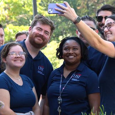 Pryor, second from left, poses with fellow members of the Counseling and Psychological Services (CAPS) department at the opening of the renovated Recreation, Fitness and Wellness Center. CAPS is located on the second floor. 