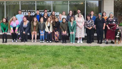 Senior artists gathered in front of the Gallery