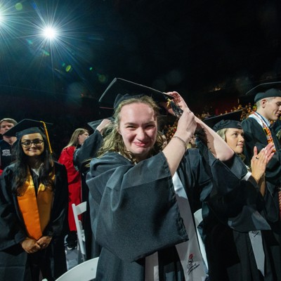 A student turns her tassel at a Commencement Ceremony in Liberty Arena, Home of the Screaming Eagles.